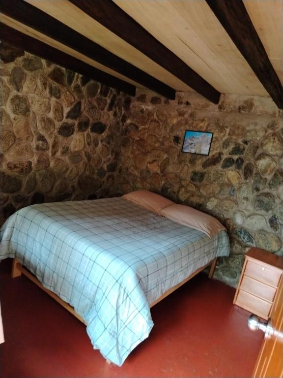 Postel nebo postele na pokoji v ubytování HOSTEL SAMANA WASI CHAULLAY
