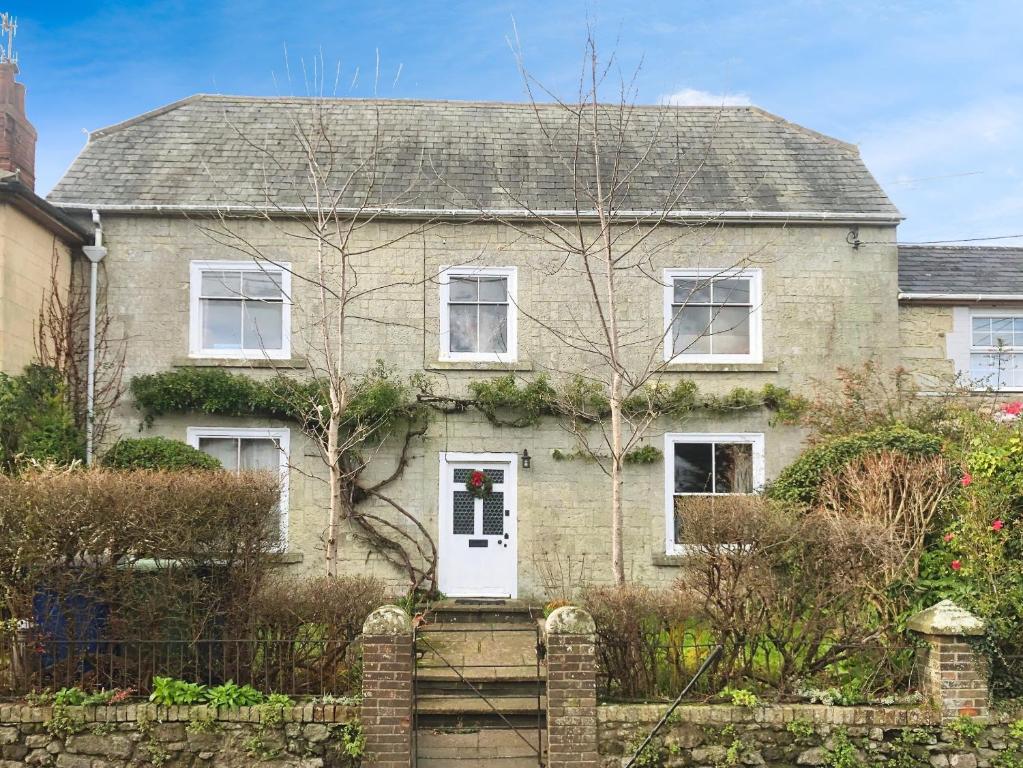 a brick house with a wreath on the door at Kildare in Niton