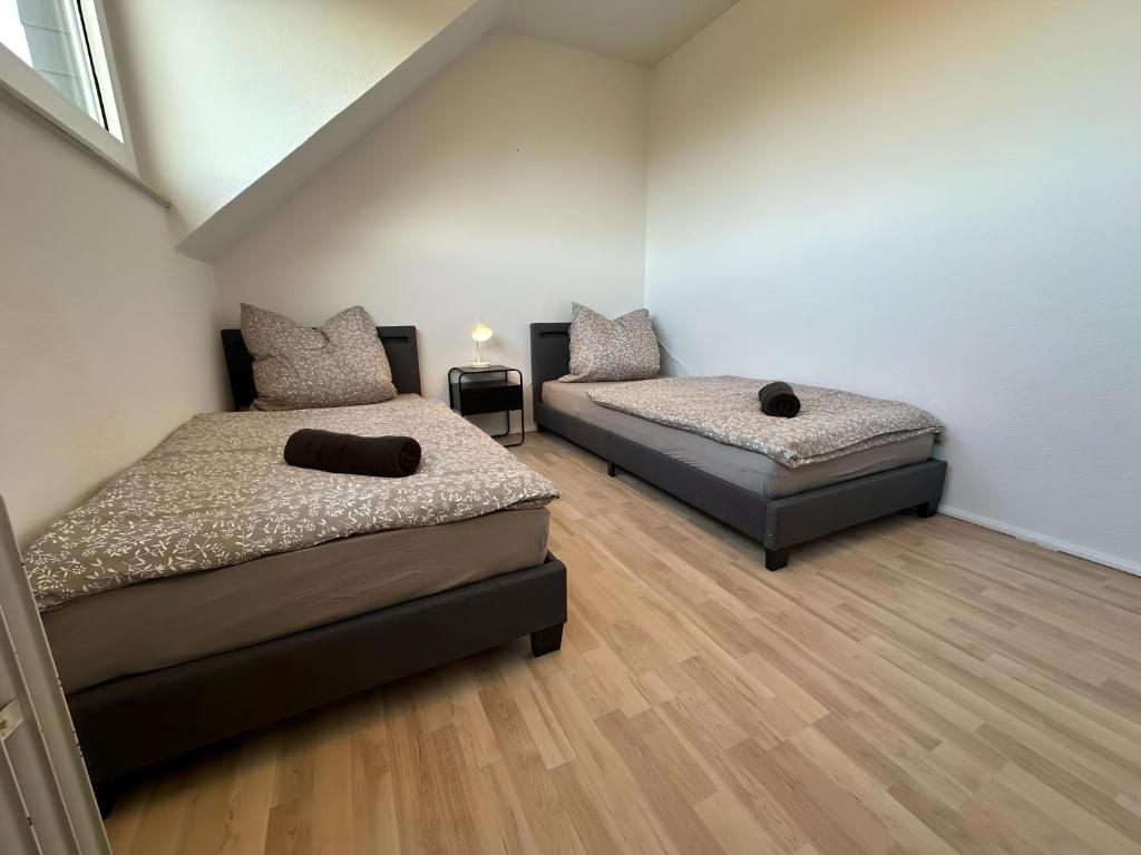 Ένα ή περισσότερα κρεβάτια σε δωμάτιο στο H&S Host & Sleep Emsdetten Groß & Ruhig