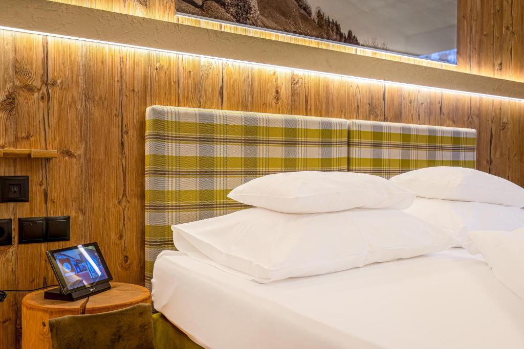 Postel nebo postele na pokoji v ubytování Hotel Kirchbichlhof