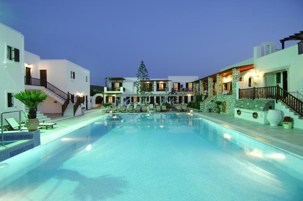 a large swimming pool in the middle of a building at Contaratos Beach Hotel in Naousa