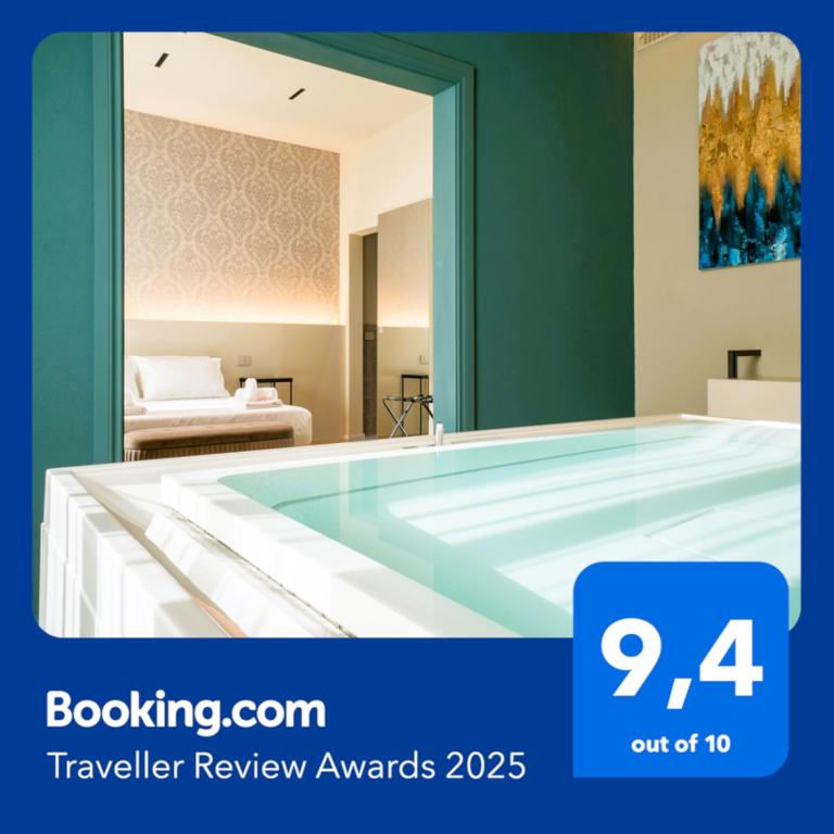 a large swimming pool in a room with a bedroom at SAVANTO in Termoli