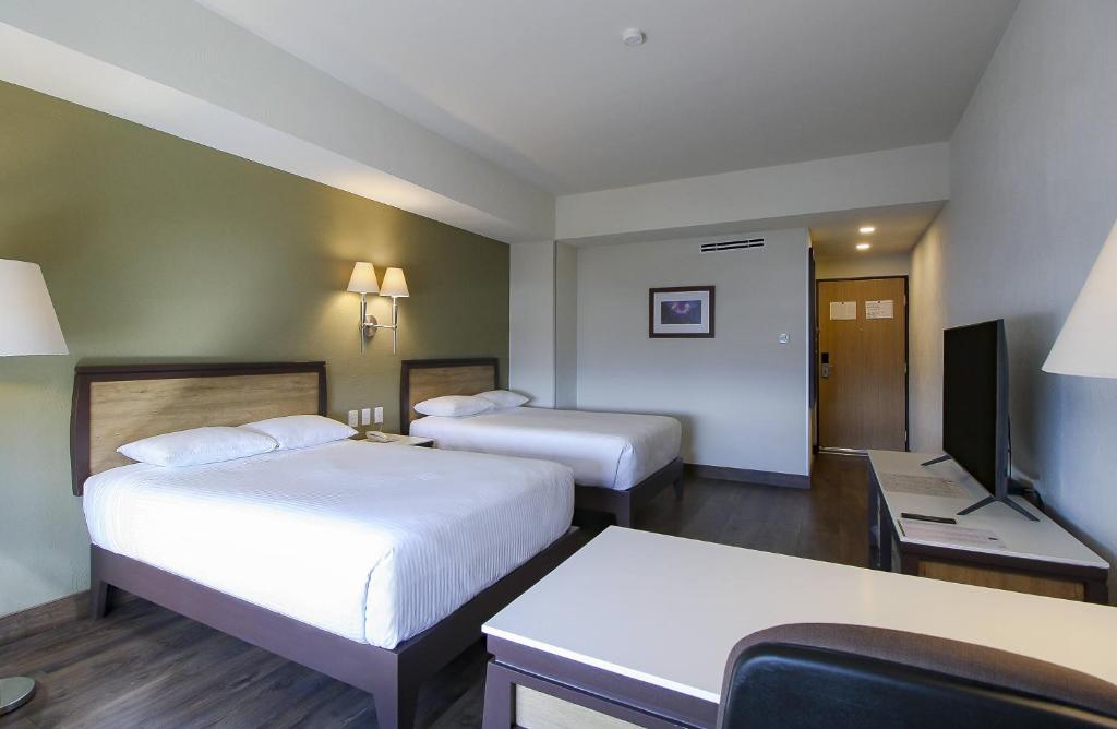 Postel nebo postele na pokoji v ubytování Hotel Turotel Morelia
