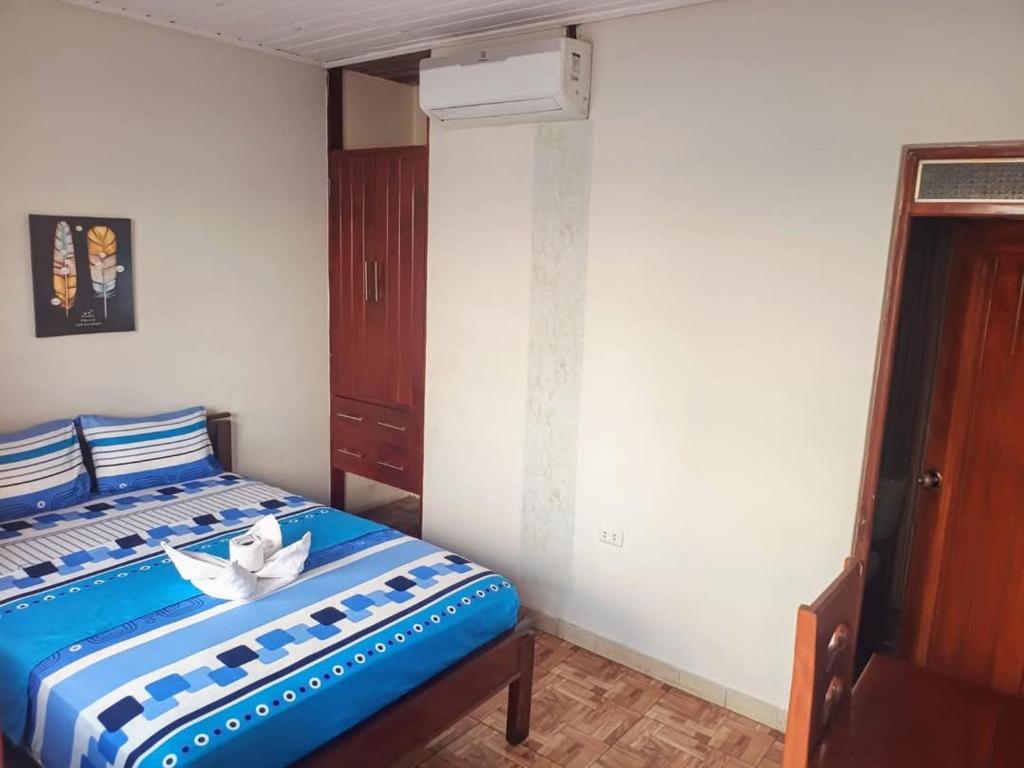 Postel nebo postele na pokoji v ubytování Hostal Sol de Iquitos