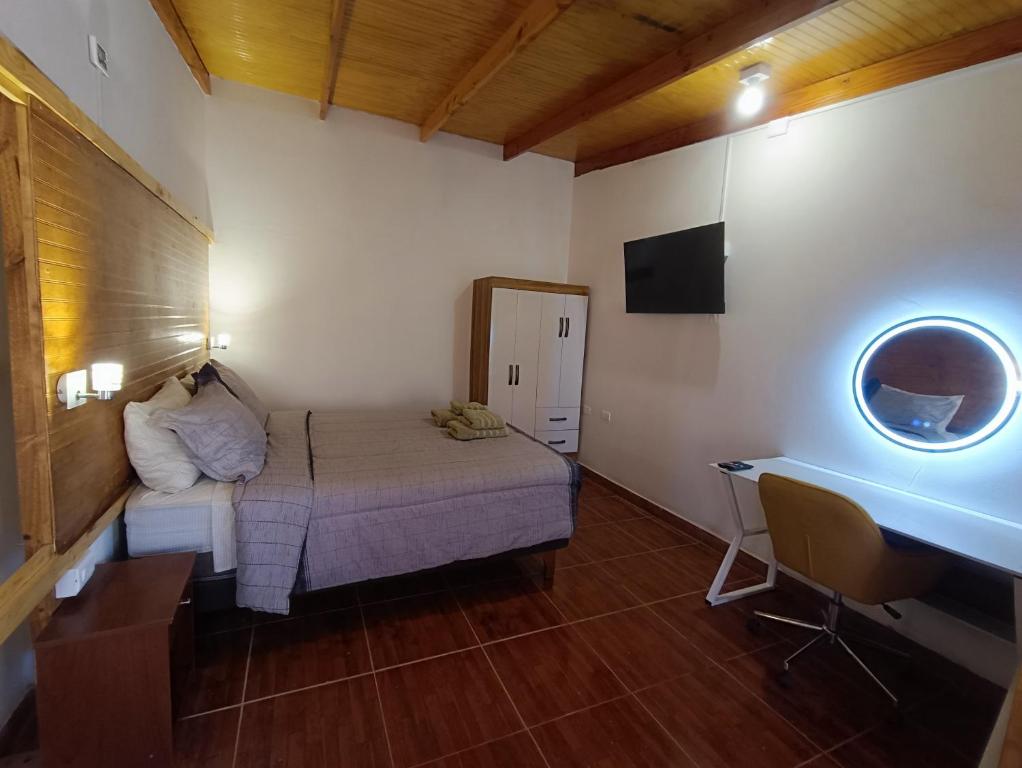 Postel nebo postele na pokoji v ubytování Hostal Yurak