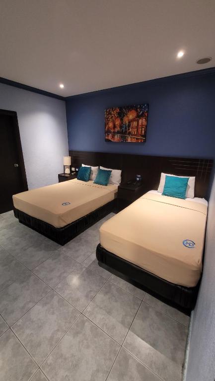 Postel nebo postele na pokoji v ubytování Hotel Del Centro