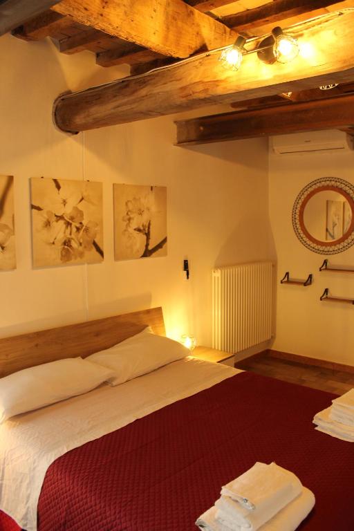 Postel nebo postele na pokoji v ubytování B&B Ca Rossa