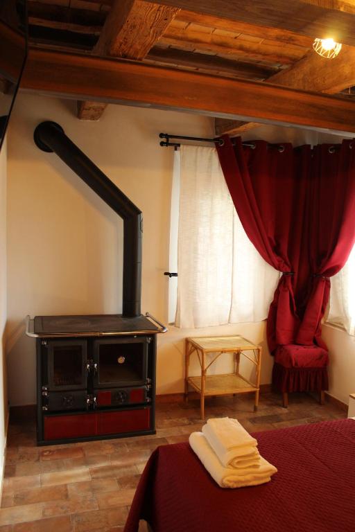 Postel nebo postele na pokoji v ubytování B&B Ca Rossa