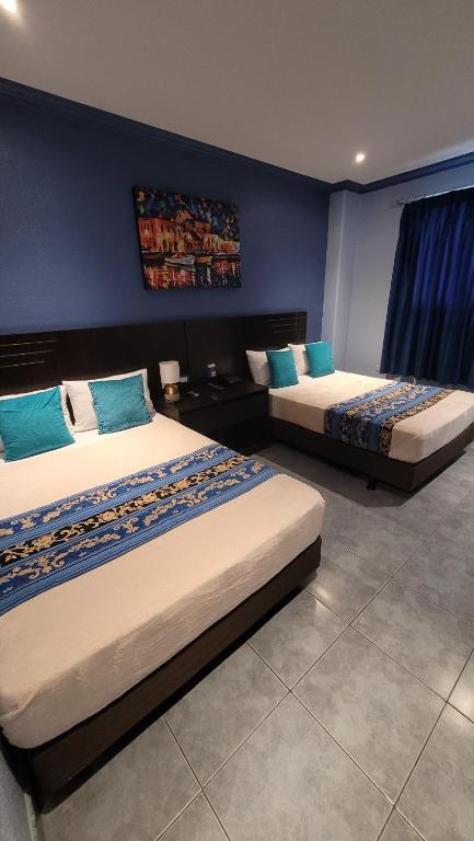 Postel nebo postele na pokoji v ubytování Hotel Del Centro