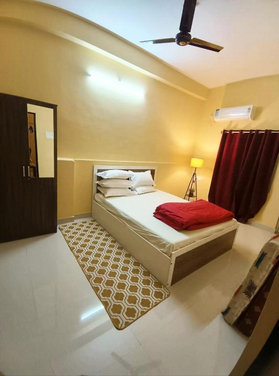 Postel nebo postele na pokoji v ubytování Bliss Homestay