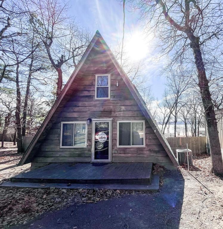a small house with a gambrel roof at LakeFire Cabin in Eufaula