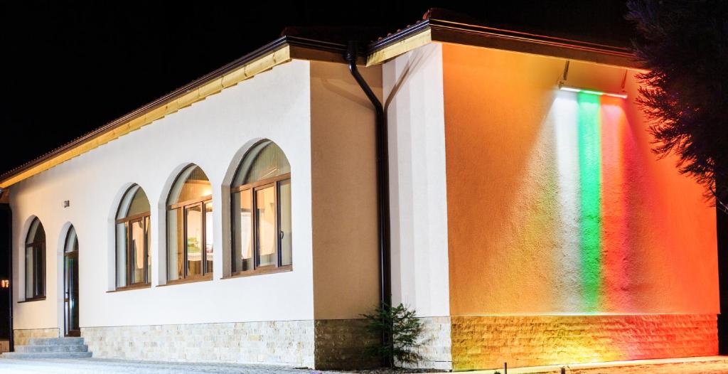 a building with a rainbow on the side of it at Hotel Nikol in Dolna Banya