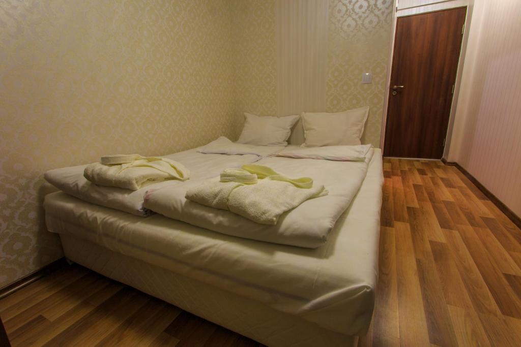 Postel nebo postele na pokoji v ubytování Hotel Nikol
