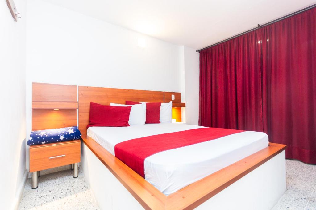 Postel nebo postele na pokoji v ubytování Hotel Bicentenario Rionegro
