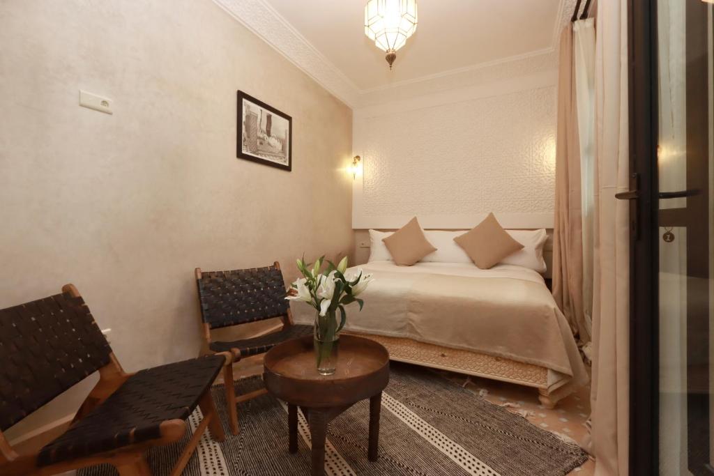 Postel nebo postele na pokoji v ubytování Riad Valentine