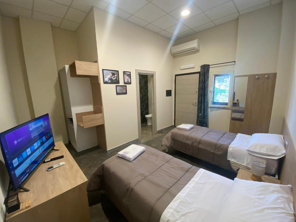 Postel nebo postele na pokoji v ubytování B&B l'angoletto