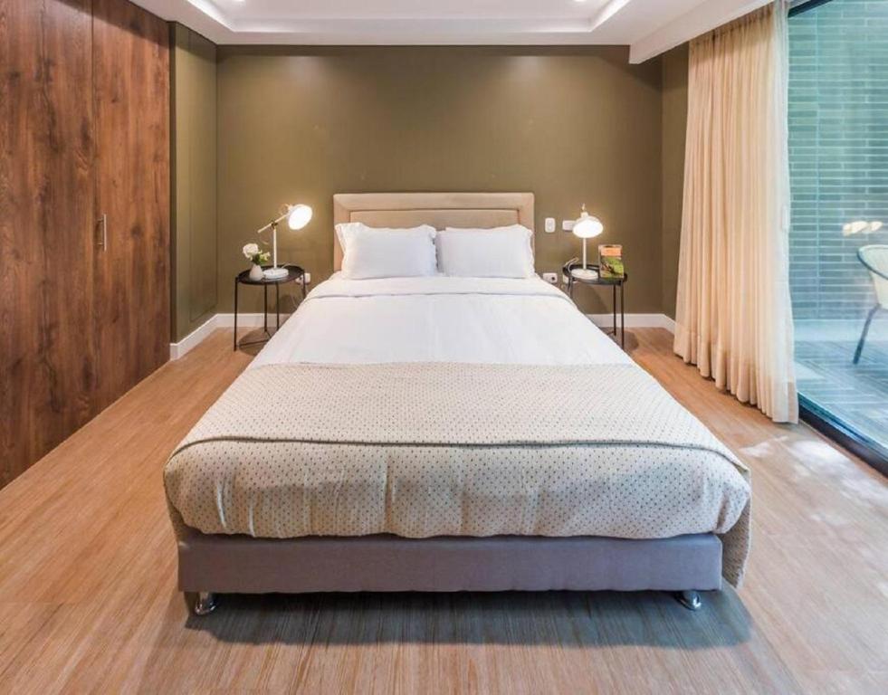 Voodi või voodid majutusasutuse El Tesoro Medellín Hab315 by Letoh toas