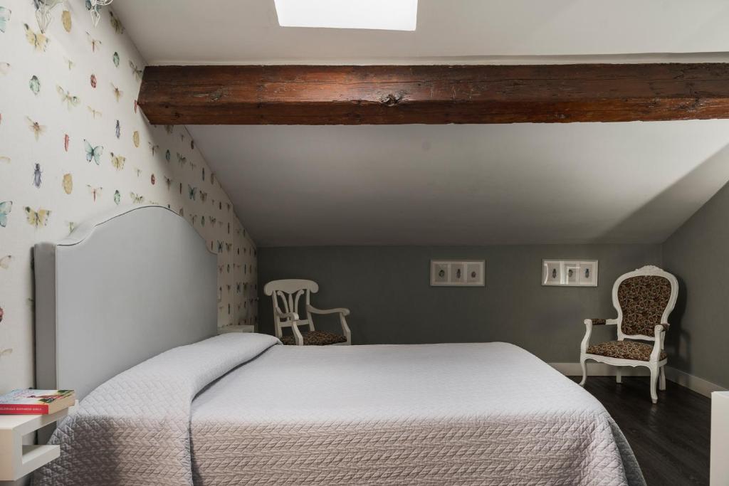 Postel nebo postele na pokoji v ubytování Maxxim Hotel & Loft