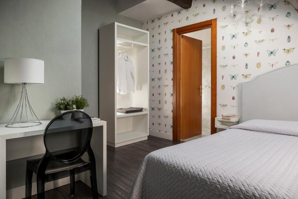 Postel nebo postele na pokoji v ubytování Maxxim Hotel & Loft