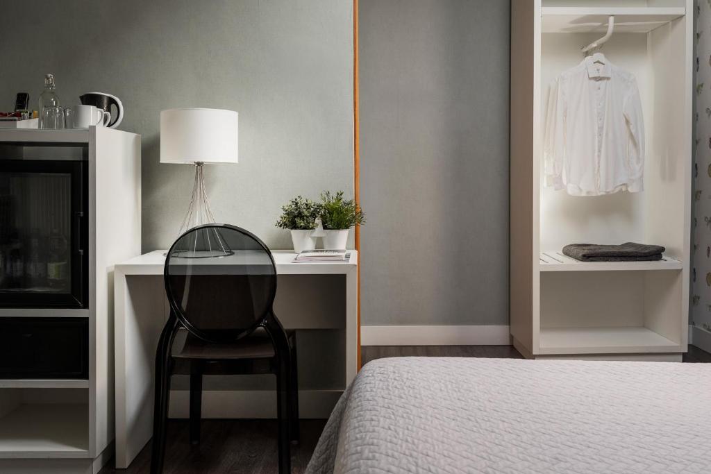 Postel nebo postele na pokoji v ubytování Maxxim Hotel & Loft