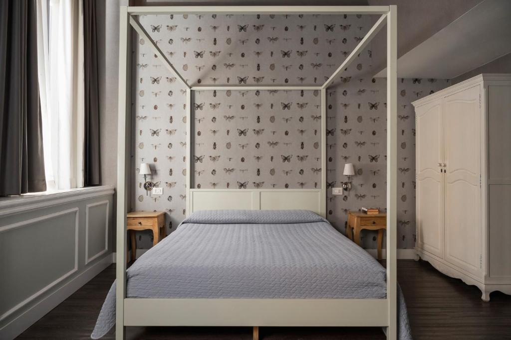 Postel nebo postele na pokoji v ubytování Maxxim Hotel & Loft