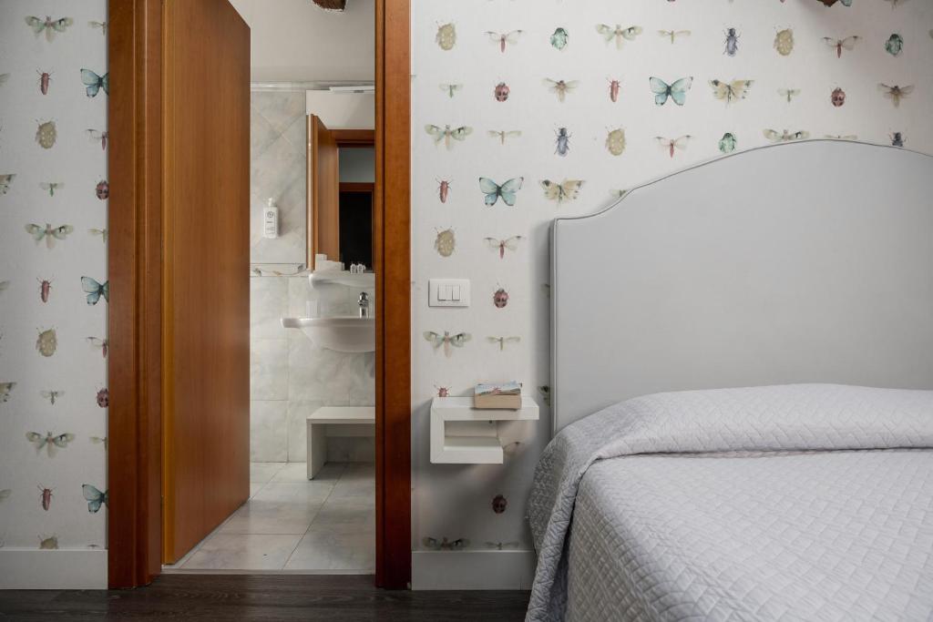 Postel nebo postele na pokoji v ubytování Maxxim Hotel & Loft