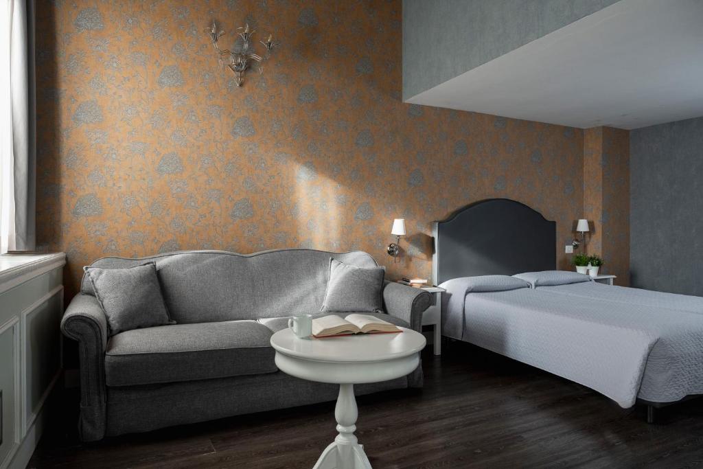 Postel nebo postele na pokoji v ubytování Maxxim Hotel & Loft