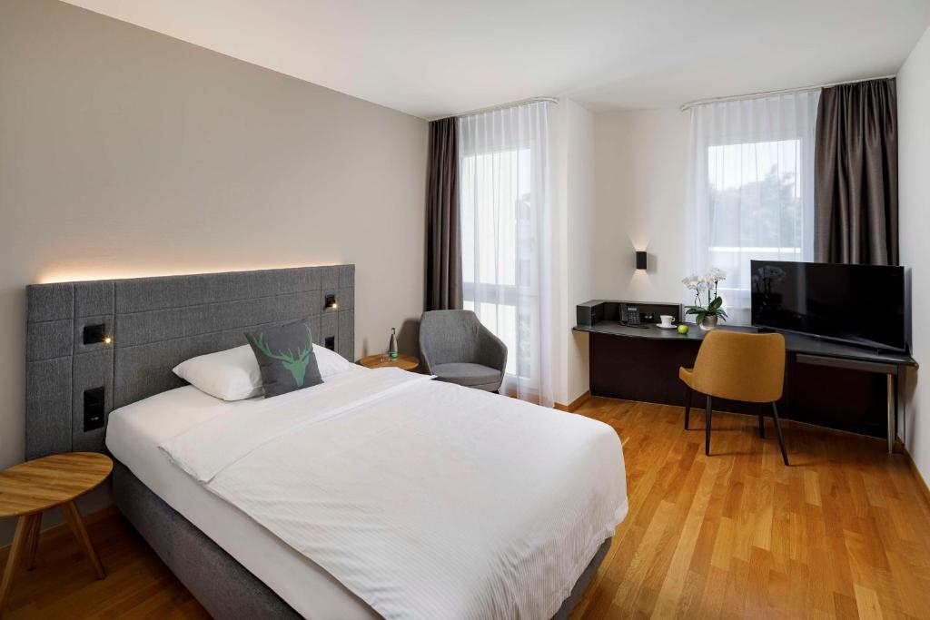Postel nebo postele na pokoji v ubytování Hotel Allegra Lodge