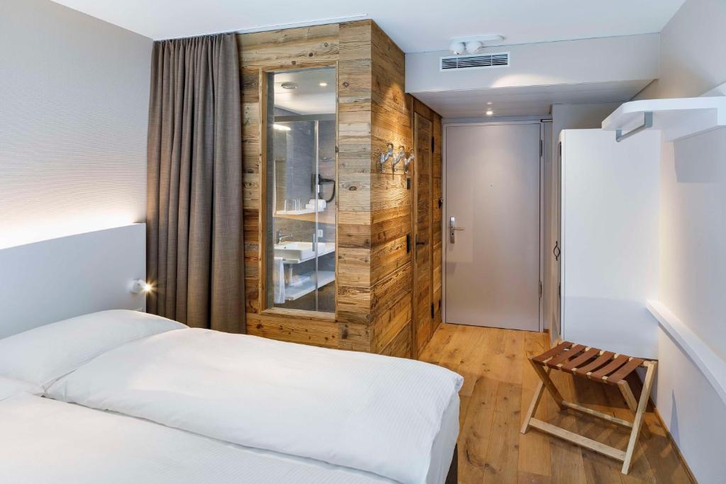 Postel nebo postele na pokoji v ubytování Hotel Allegra Lodge