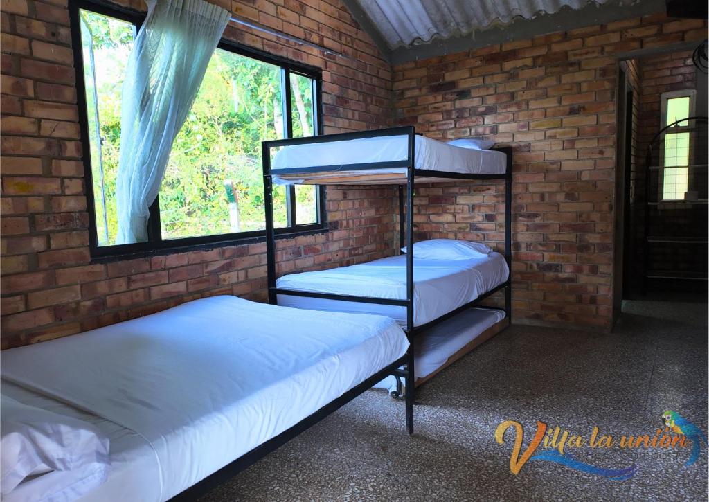 Postel nebo postele na pokoji v ubytování Finca Campestre Villa La Unión Hotel en Mesitas