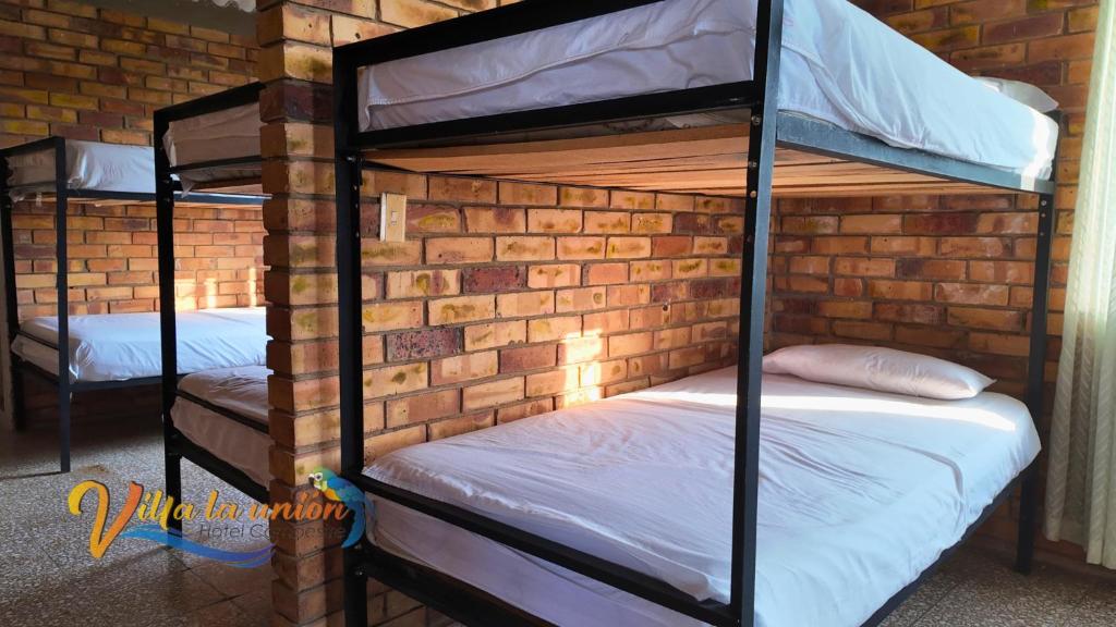 Postel nebo postele na pokoji v ubytování Finca Campestre Villa La Unión Hotel en Mesitas