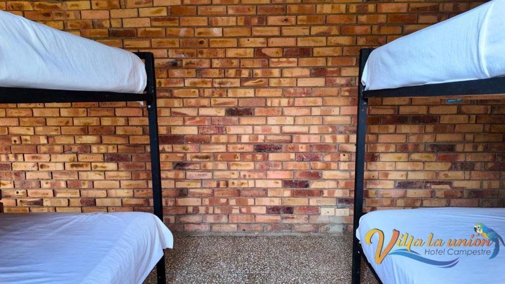Postel nebo postele na pokoji v ubytování Finca Campestre Villa La Unión Hotel en Mesitas