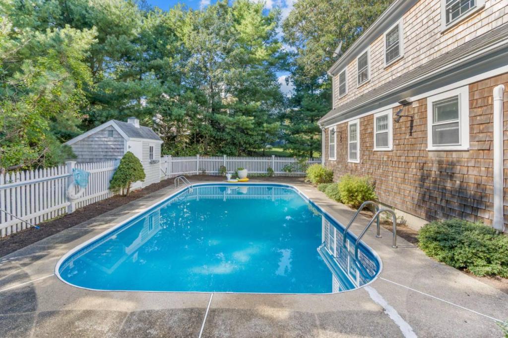 a swimming pool in the backyard of a house at Pool Half Mile to Beach in Harwich