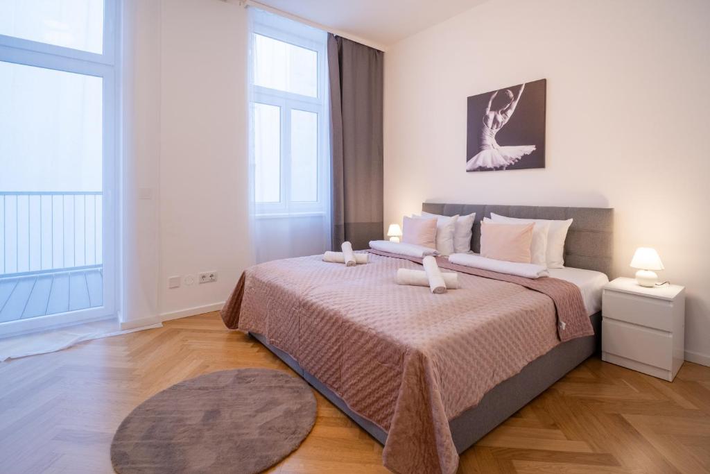 Ένα ή περισσότερα κρεβάτια σε δωμάτιο στο Home Sweet Home - Vienna Central