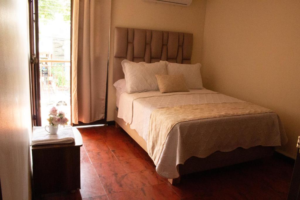 Postel nebo postele na pokoji v ubytování Hotel Casa Manta Cali