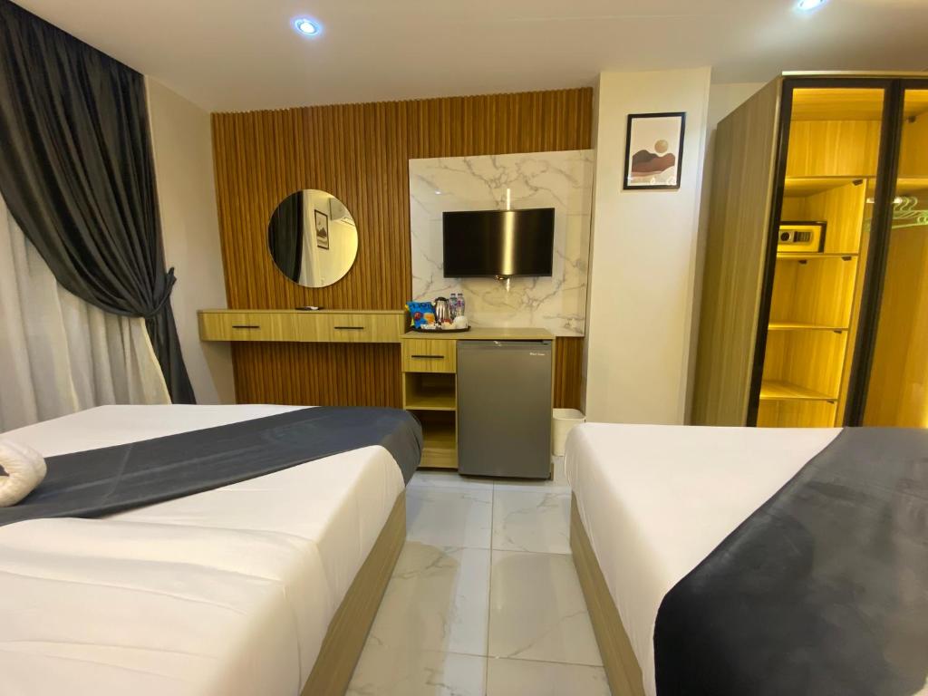Postel nebo postele na pokoji v ubytování Rehana Pyramids Hotel