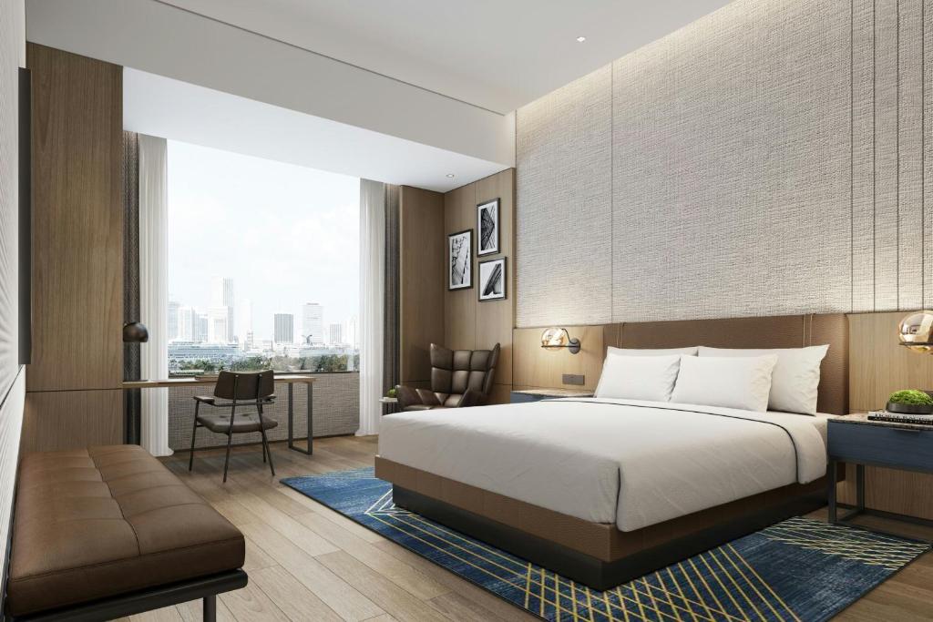 Postel nebo postele na pokoji v ubytování Four Points by Sheraton Hengyang Zhengxiang