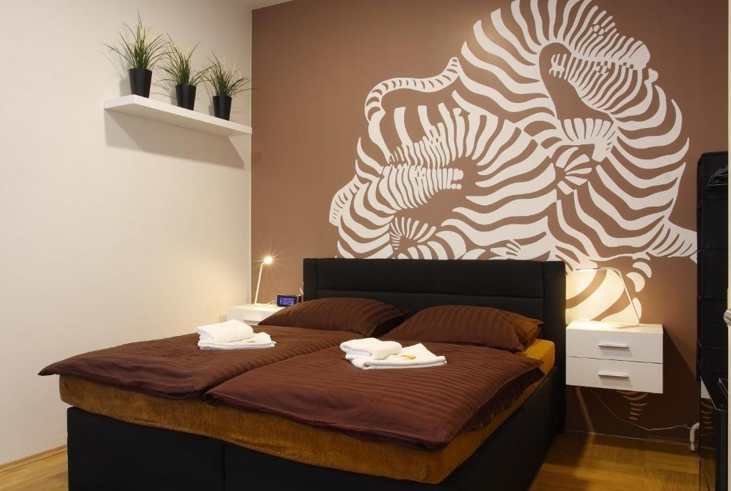 Postel nebo postele na pokoji v ubytování Atrium Apartments