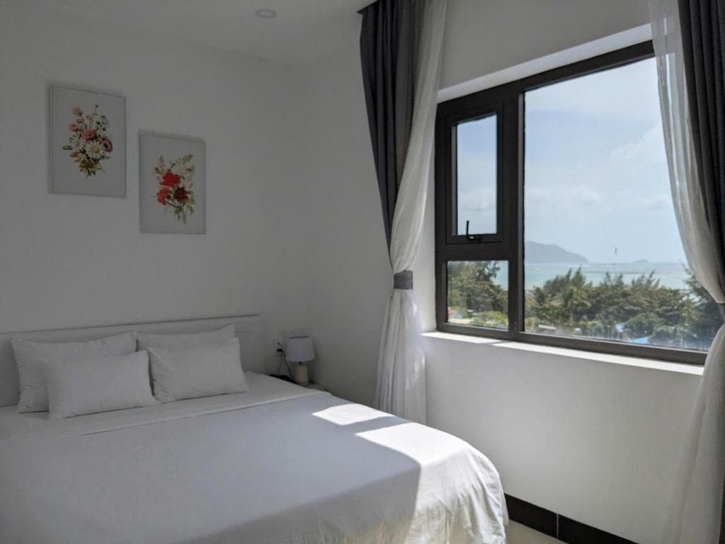 Postel nebo postele na pokoji v ubytování Horizon Côn Đảo Hotel