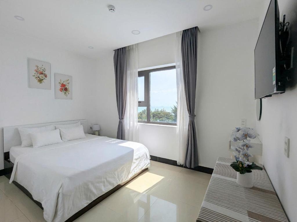 Postel nebo postele na pokoji v ubytování Horizon Côn Đảo Hotel