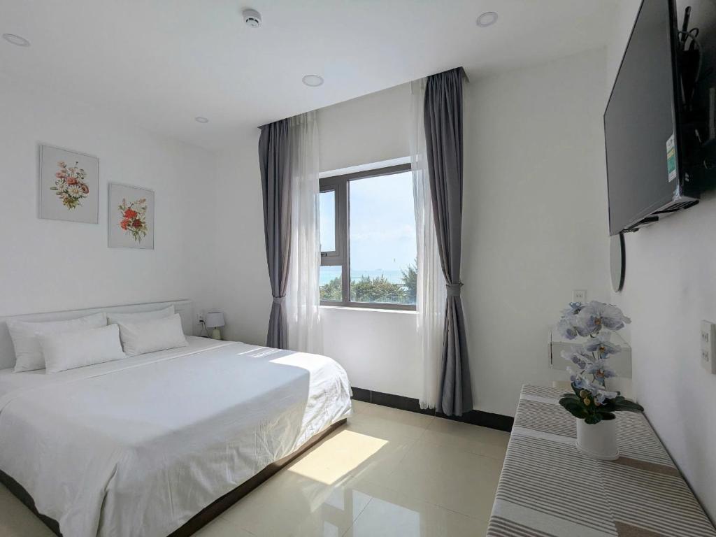 Postel nebo postele na pokoji v ubytování Horizon Côn Đảo Hotel
