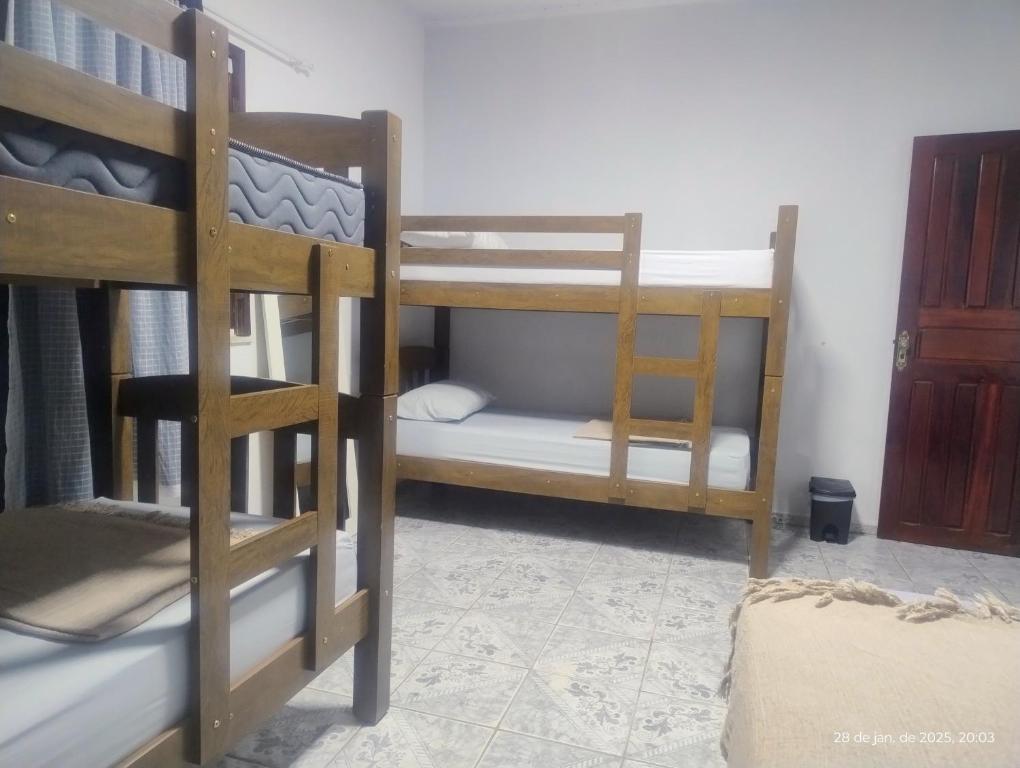 Postel nebo postele na pokoji v ubytování hostel xamã