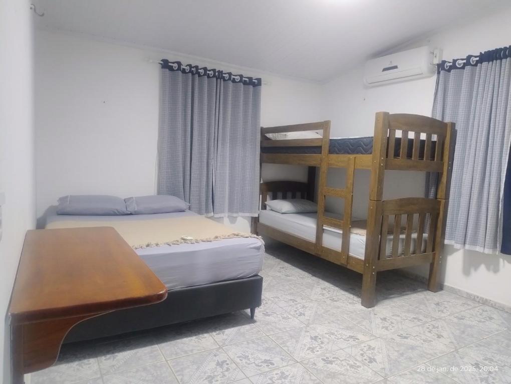 Postel nebo postele na pokoji v ubytování hostel xamã