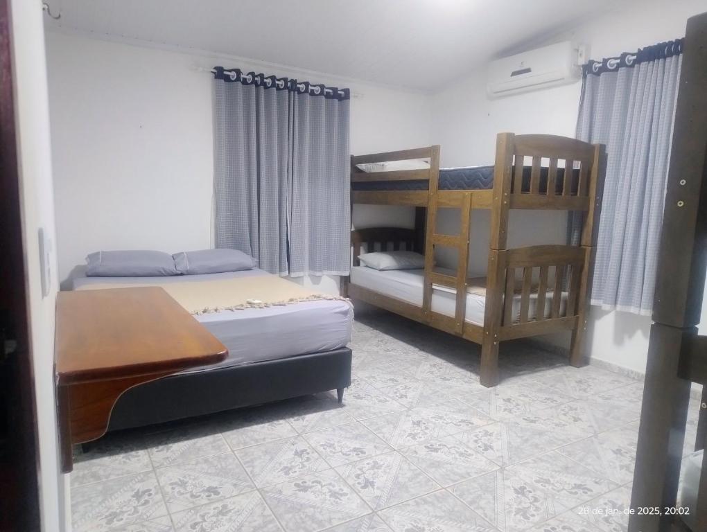 Postel nebo postele na pokoji v ubytování hostel xamã