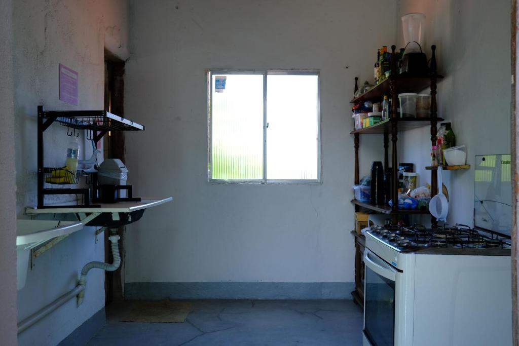 Kuchyň nebo kuchyňský kout v ubytování Hostel Divino do Carmo