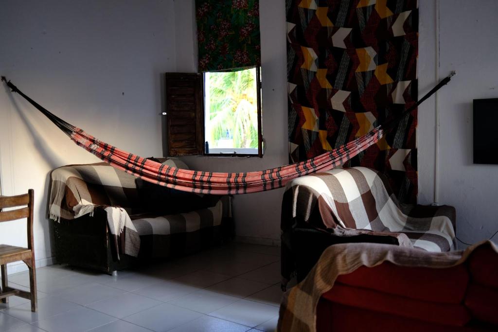 Postel nebo postele na pokoji v ubytování Hostel Divino do Carmo
