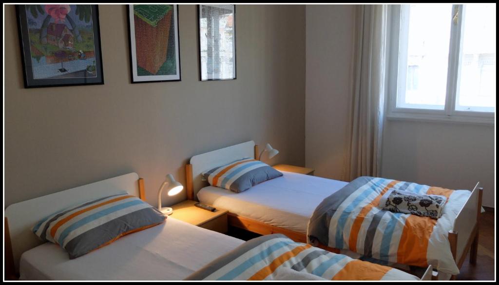 Łóżko lub łóżka w pokoju w obiekcie B&B Piazza Goldoni