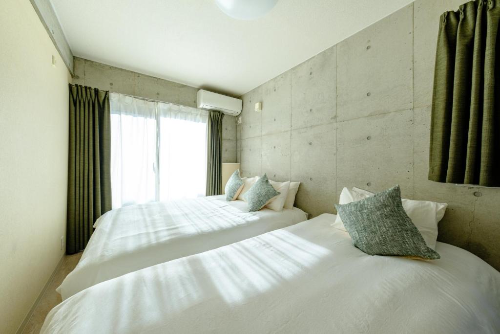 Postel nebo postele na pokoji v ubytování DeLIGHT HOTEL
