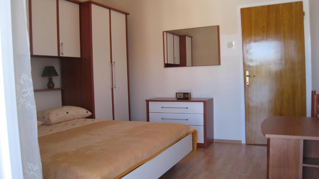 Postel nebo postele na pokoji v ubytování Apartment "Kod None"