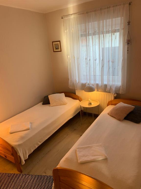 Postel nebo postele na pokoji v ubytování Mátrai Kisház